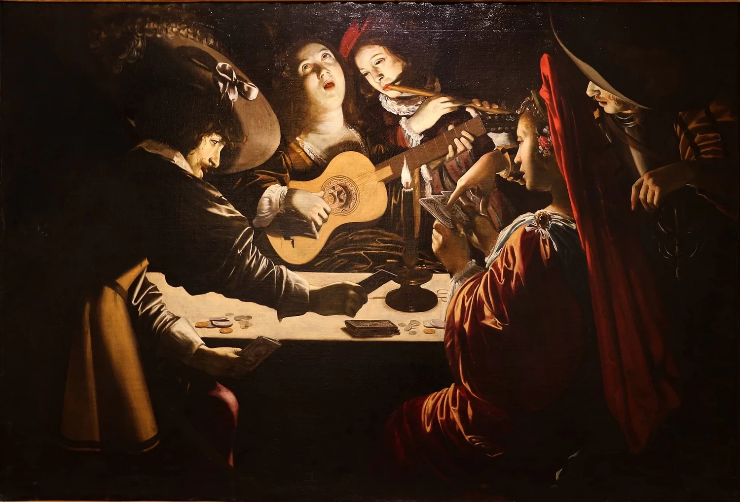 Giocatori e suonatori al lume di candela o allegoria del vizio del gioco e della lussuria